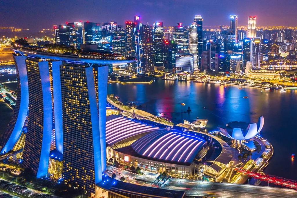 A crowd of people at a rooftop bar in Singapore, representing the vibrant world of nightlife.