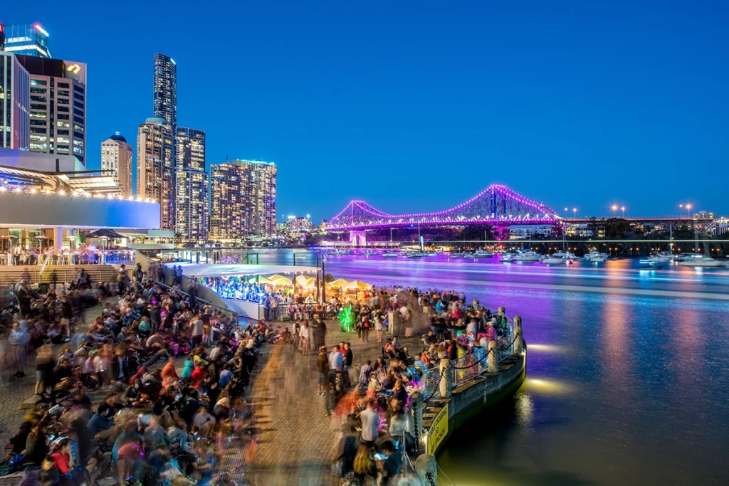 A panorama of Singapore at night from a skyscraper, showcasing the global world of nightlife